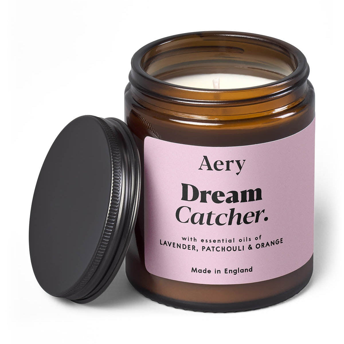 Aery Dream Catcher candle in a glass jar with a pink label on a white background